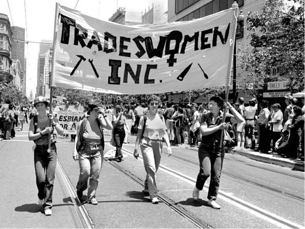 Women marching with a banner that reads "Transwomen Inc."