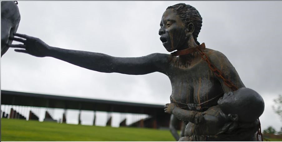 Slave woman and child statue
