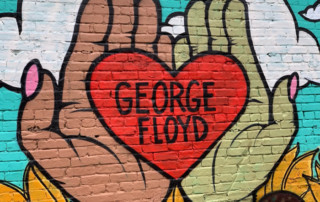 George Floyd mural, heart in hands